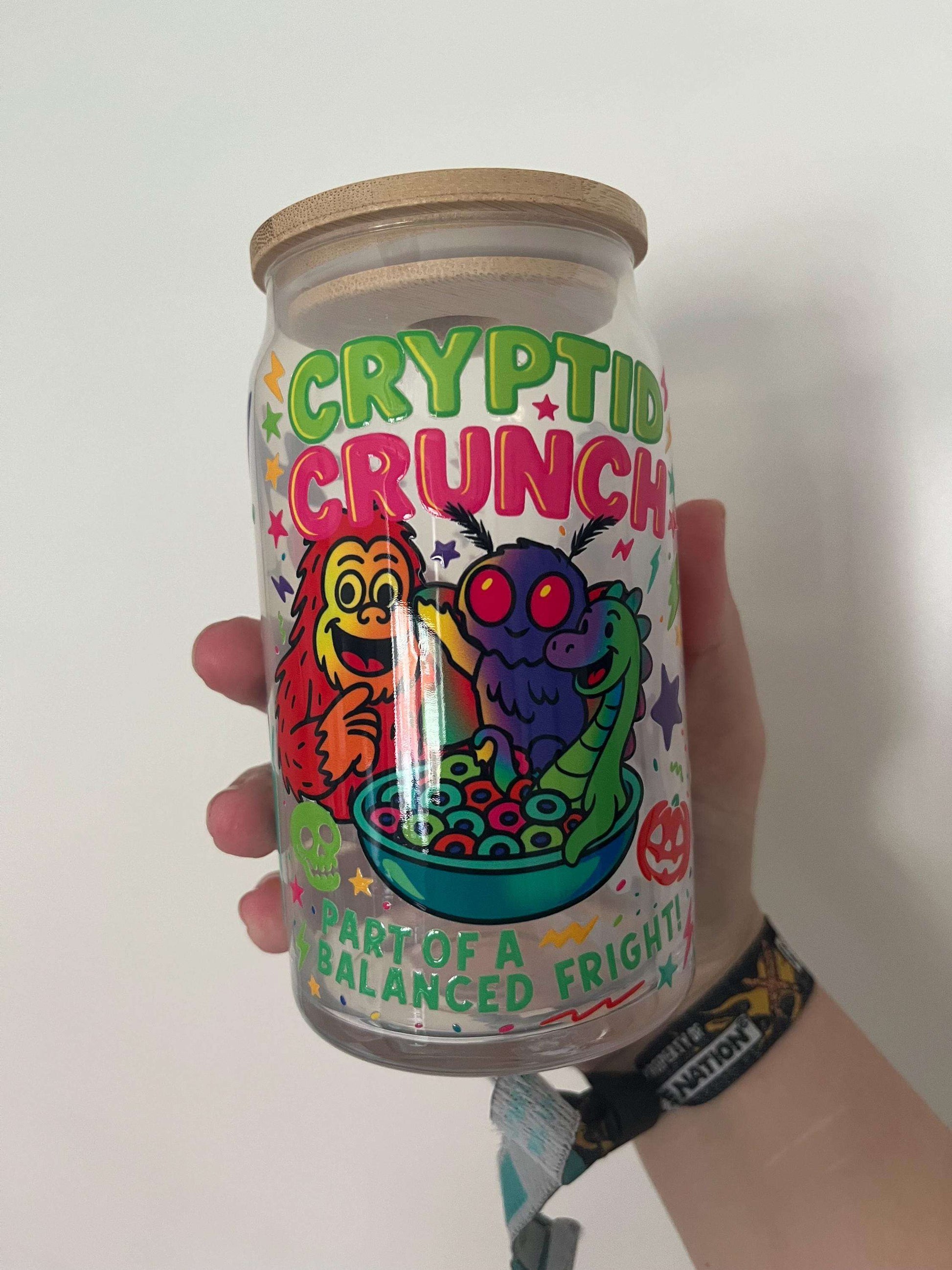 cyrptid themed glass tumbler featuring mothman big foot lochness monster