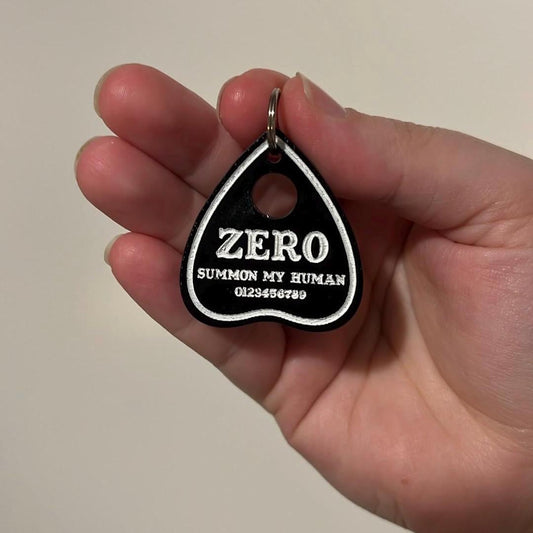 Acrylic pet id tag shaped like a planchette